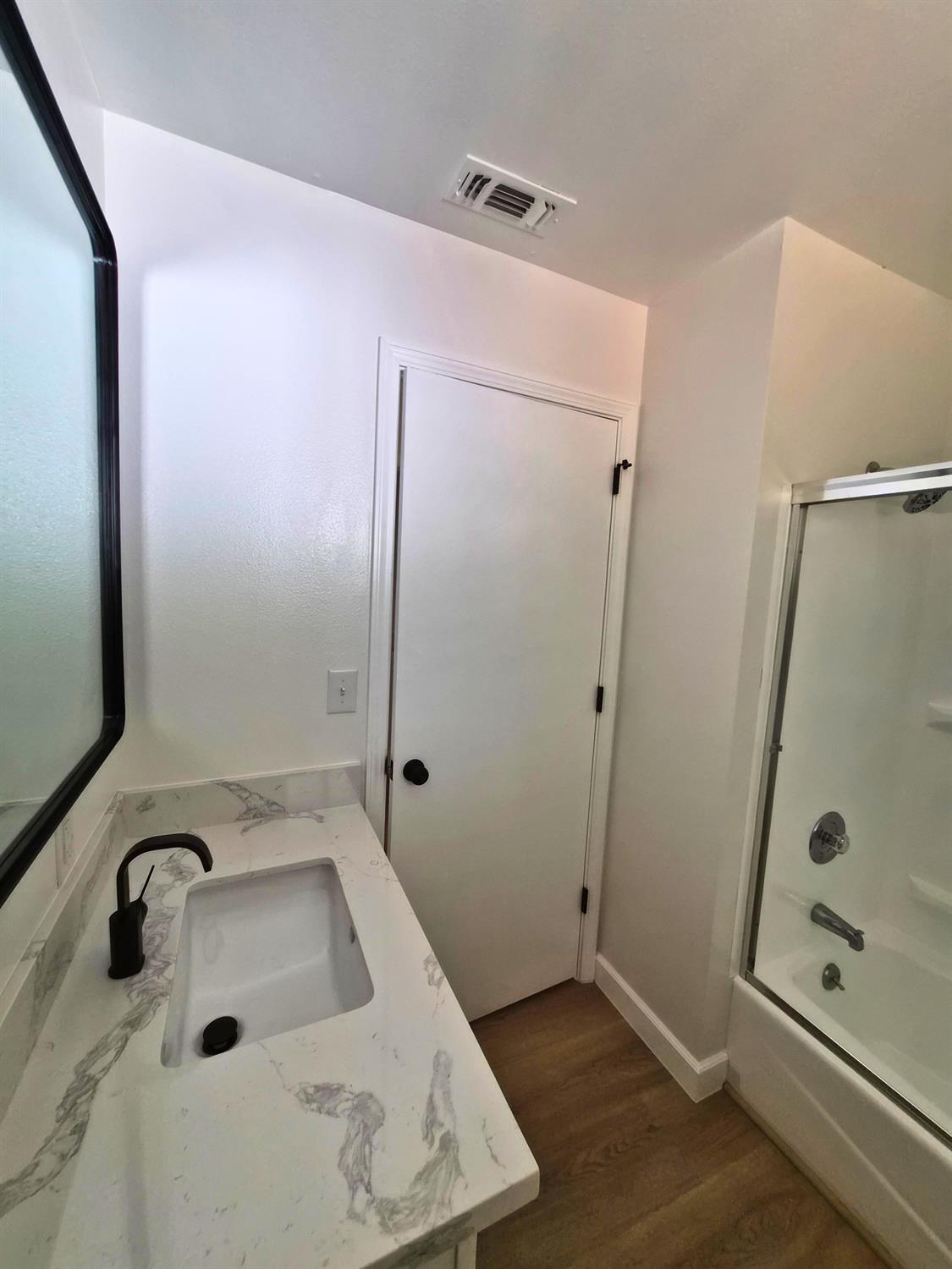 21640 Clute Canyon Road Volcano, CA 95689 - Photo 20 of 44 a bathroom with a tub sink and mirror