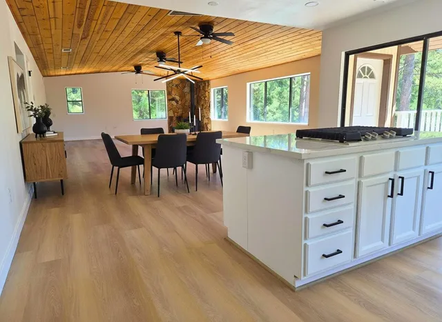 a view of kitchen with wooden floor and windows