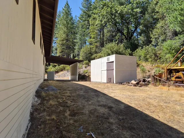 a view of a parking space near a barn