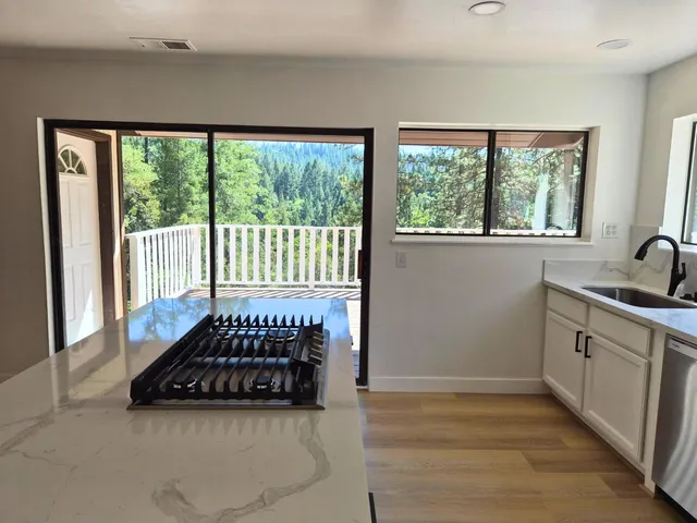 a very nice looking dining room with a large window