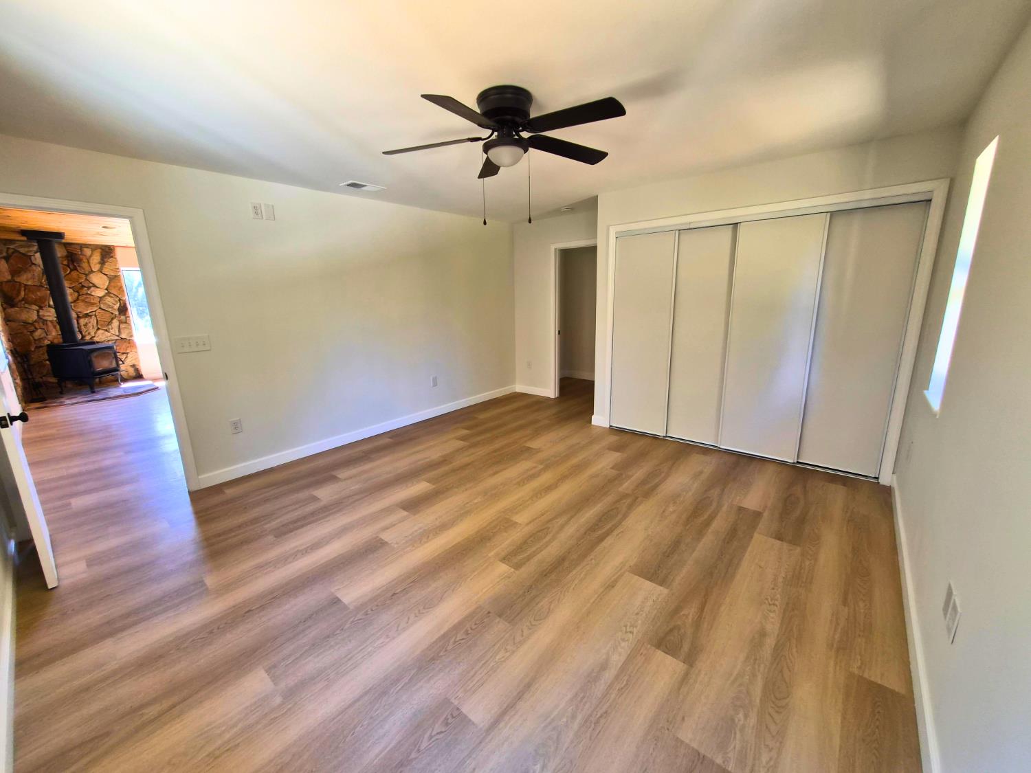 21640 Clute Canyon Road Volcano, CA 95689 - Photo 6 of 44 wooden floor in an empty room with a window