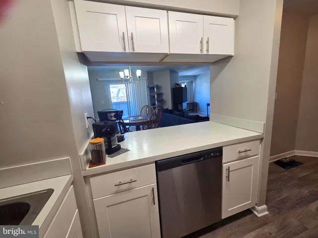 a view of a kitchen from the hallway