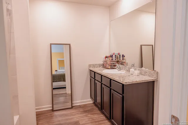 a bathroom with a sink and a mirror