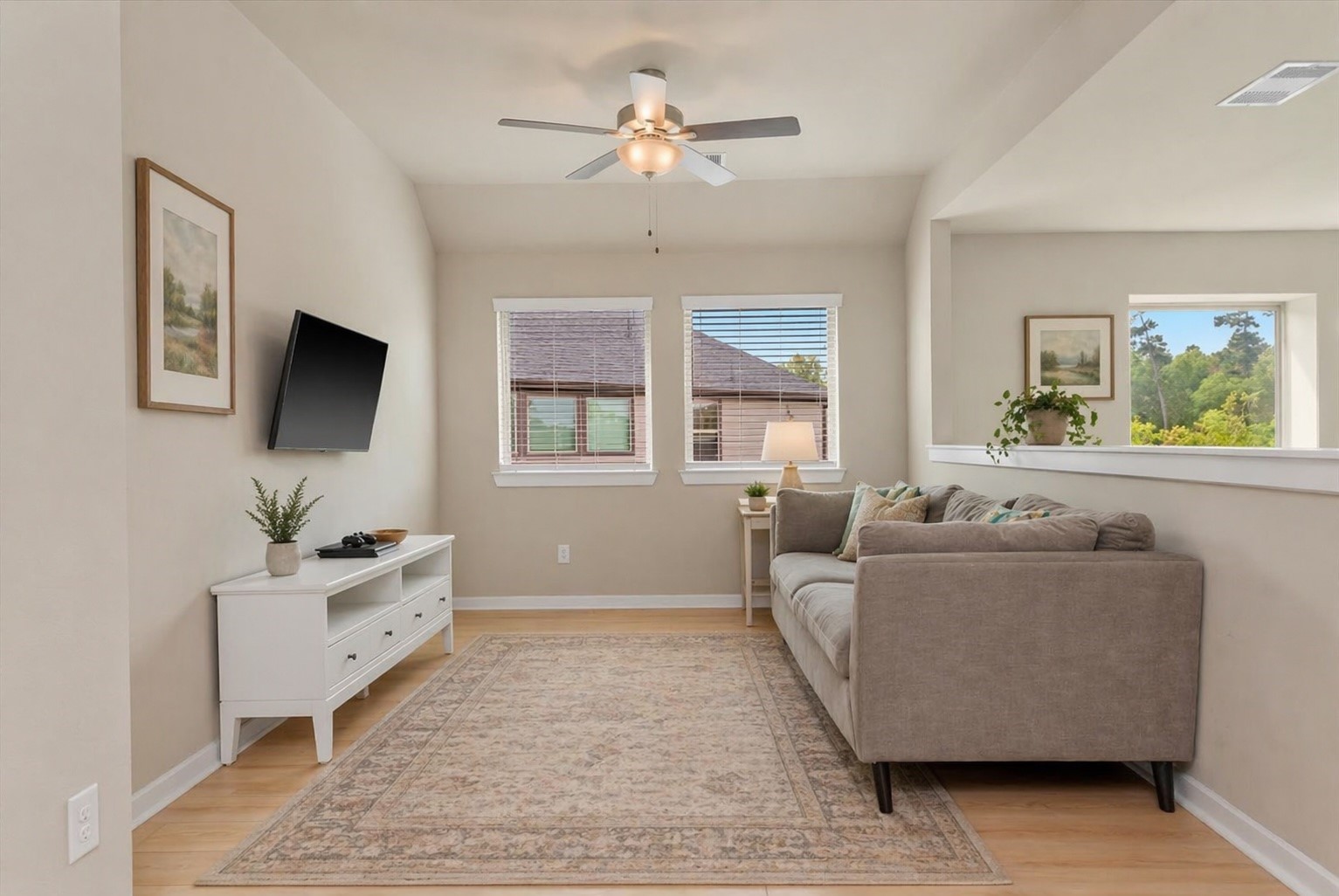 17814 Tree Of Heaven Conroe, TX 77385 - Photo 7 of 48 Spacious upstairs living area featuring abundant natural light, a functional layout, and flexible space—ideal for a game room, media room, or second living area.
