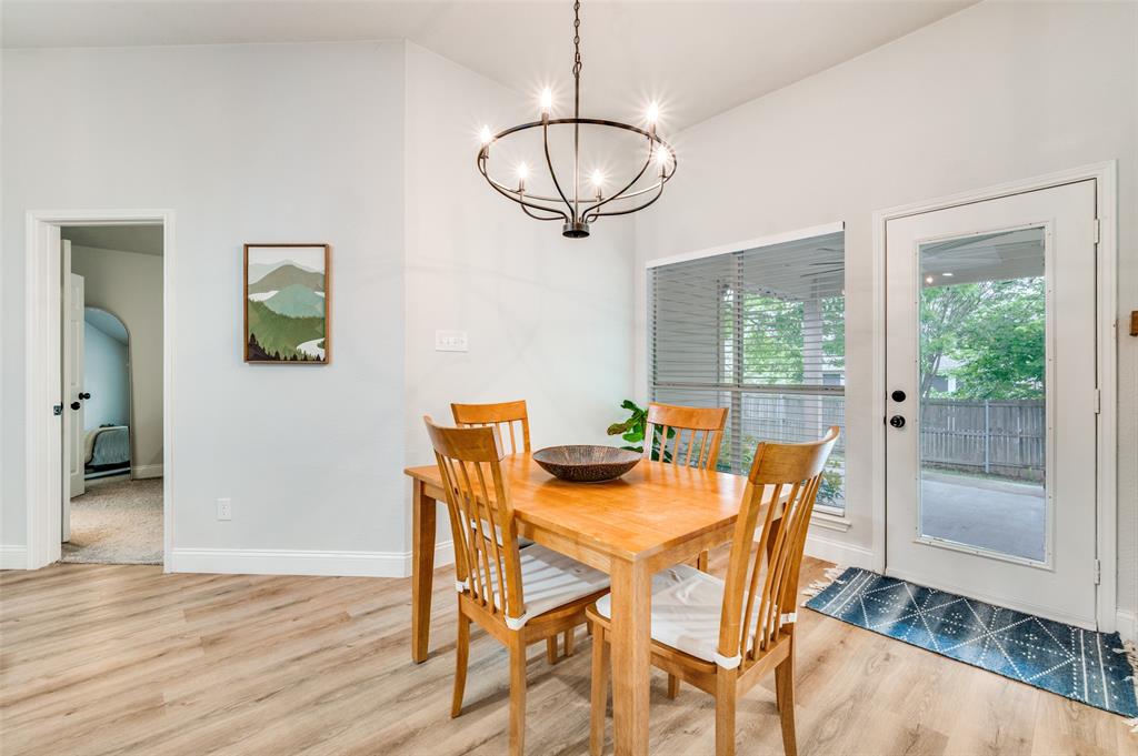 7306 Vista Ridge Lane Sachse, TX 75048 - Photo 7 of 23 a view of a dining room with furniture window and wooden floor