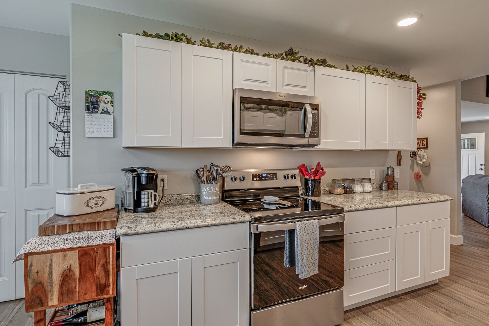 1158 Payne Road Portland, TN 37148 - Photo 12 of 31 a kitchen with granite countertop a sink stove and cabinets