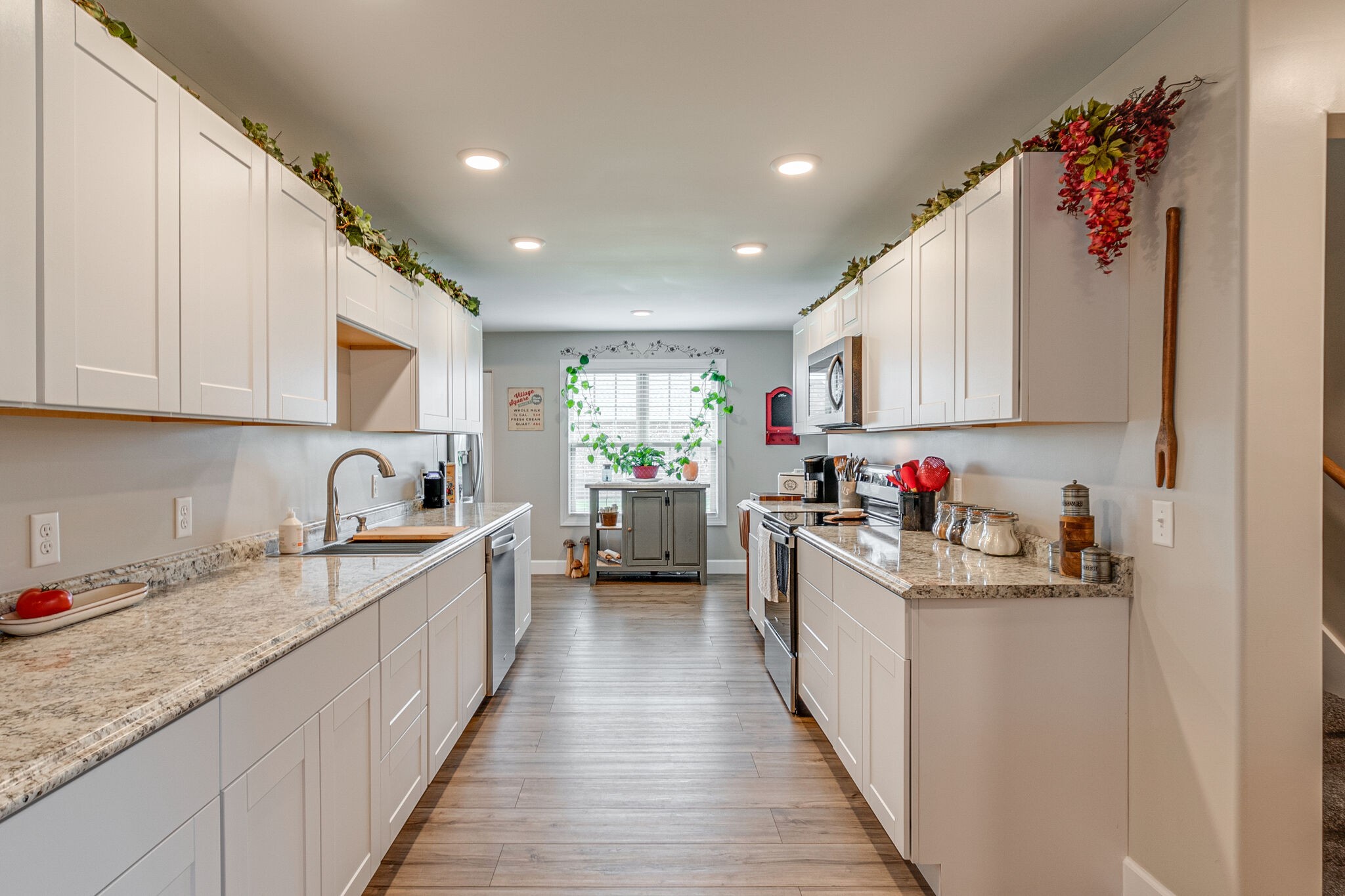 1158 Payne Road Portland, TN 37148 - Photo 13 of 31 a kitchen with granite countertop white cabinets and white appliances