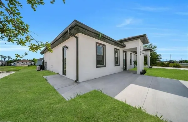 a front view of a house with a yard