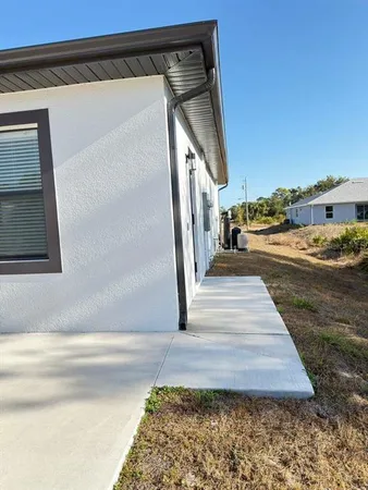 a view of backyard with large windows