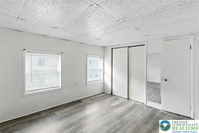 a view of hallway with wooden floor