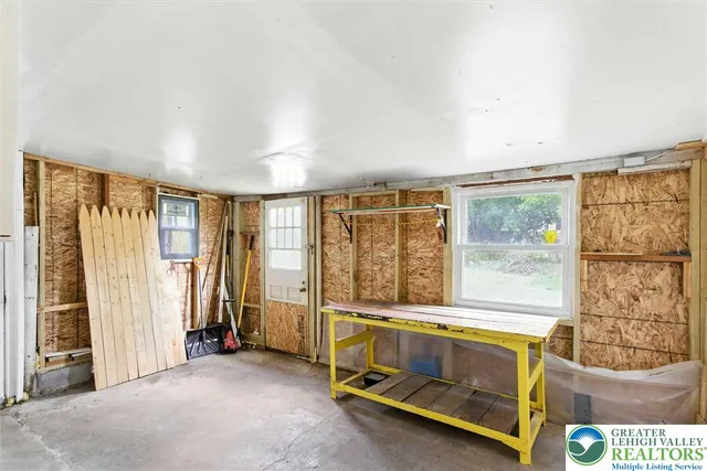 a room with a bed and a window