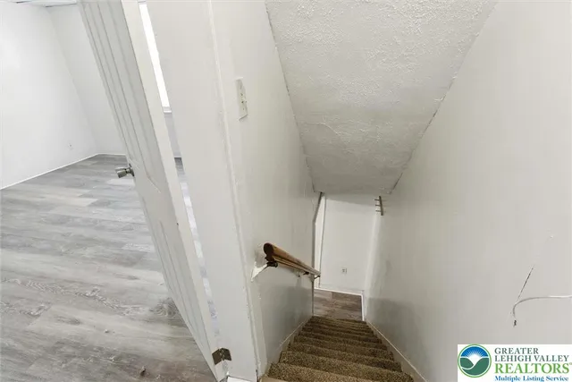 a view of a hallway view with staircase