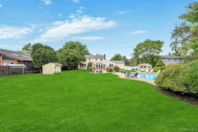 a view of a swimming pool with a garden