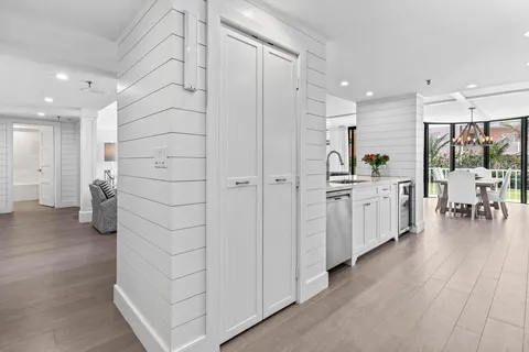 a view of a kitchen with a washer and dryer