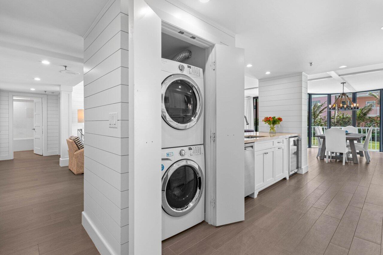 2917 South Ocean Boulevard, Unit 104 Highland Beach, FL 33487 - Photo 14 of 57 a view of a kitchen with a washer and dryer