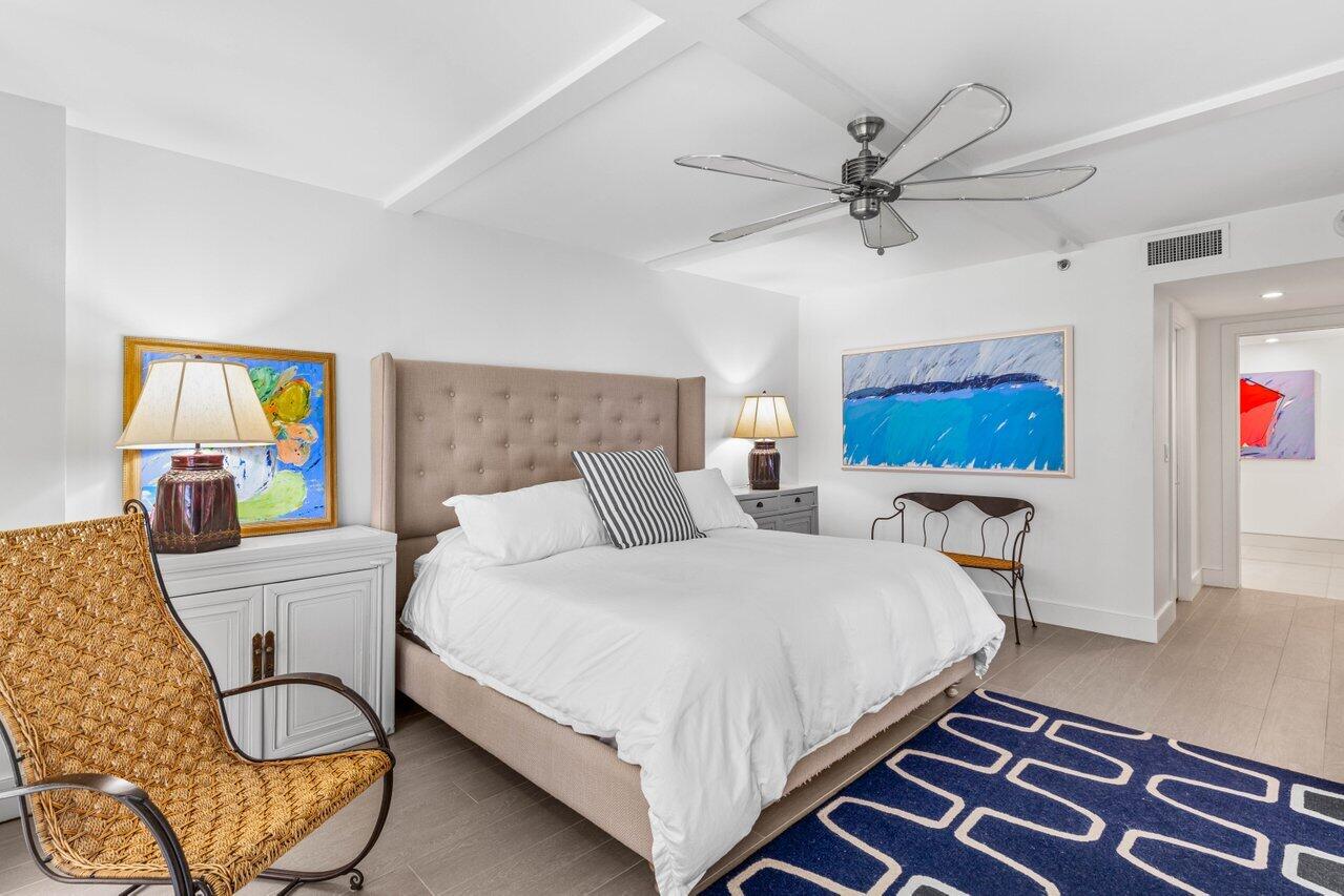 2917 South Ocean Boulevard, Unit 104 Highland Beach, FL 33487 - Photo 16 of 57 a bedroom with a bed and furniture