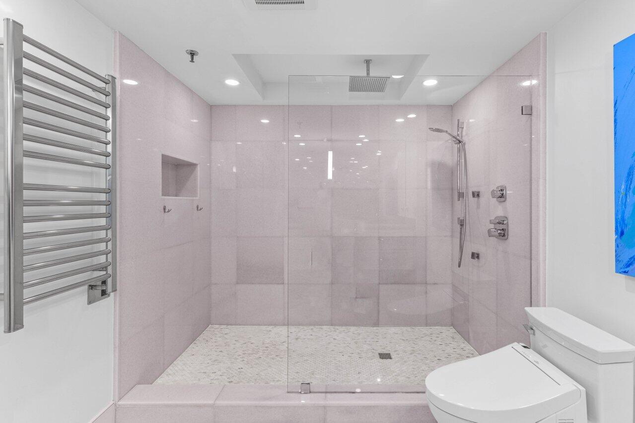 2917 South Ocean Boulevard, Unit 104 Highland Beach, FL 33487 - Photo 19 of 57 a bathroom with a bathtub and a toilet