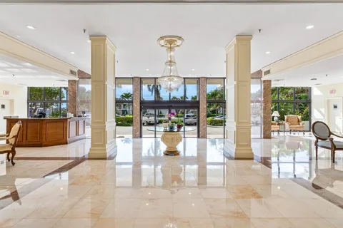 a view of a living room and kitchen
