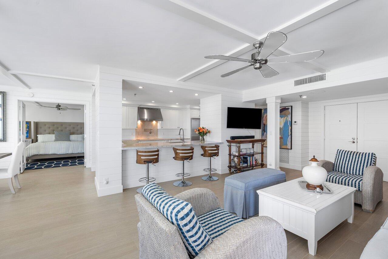 2917 South Ocean Boulevard, Unit 104 Highland Beach, FL 33487 - Photo 10 of 57 a living room with furniture and a flat screen tv