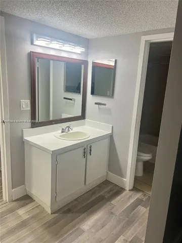 a utility room with a sink washer and dryer