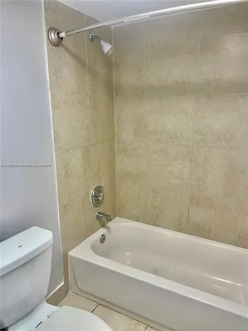 a bathroom with a sink a toilet and a bathtub