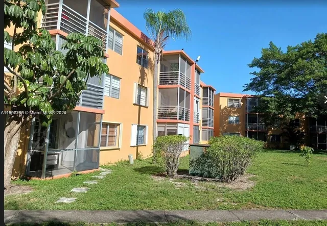 a view of a front of a house with a yard