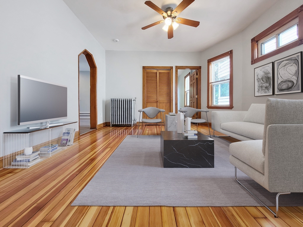 35 Dunlap Street, Unit 2 Boston, MA 02124 - Photo 1 of 12 a living room with furniture and a flat screen tv