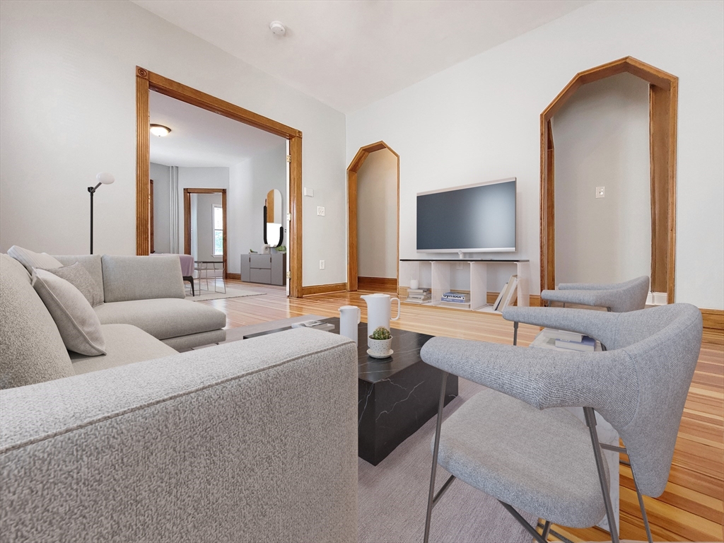 35 Dunlap Street, Unit 2 Boston, MA 02124 - Photo 2 of 12 a living room with furniture and a large mirror