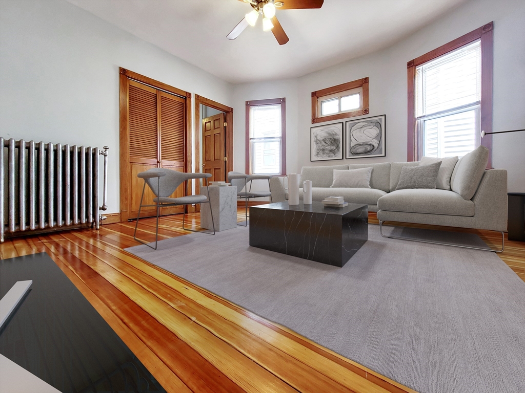 35 Dunlap Street, Unit 2 Boston, MA 02124 - Photo 3 of 12 a living room with furniture windows and wooden floor