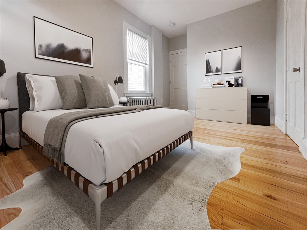 35 Dunlap Street, Unit 2 Boston, MA 02124 - Photo 7 of 12 a spacious bedroom with a bed and window
