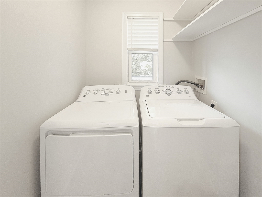 35 Dunlap Street, Unit 2 Boston, MA 02124 - Photo 10 of 12 a utility room with dryer and washer