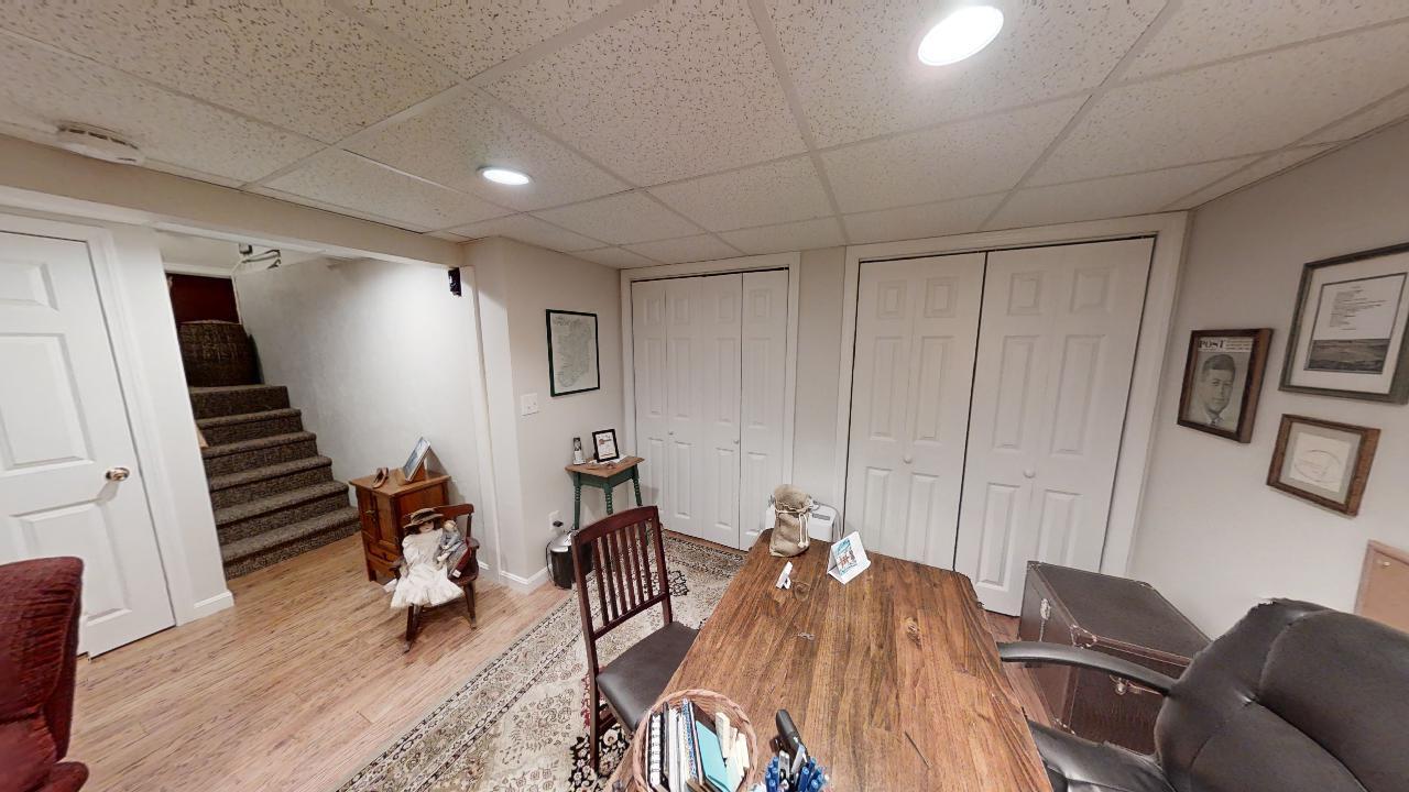 59 Route 6A, Unit 323 Orleans, MA 02653 - Photo 15 of 23 a view of a livingroom with furniture and staircase