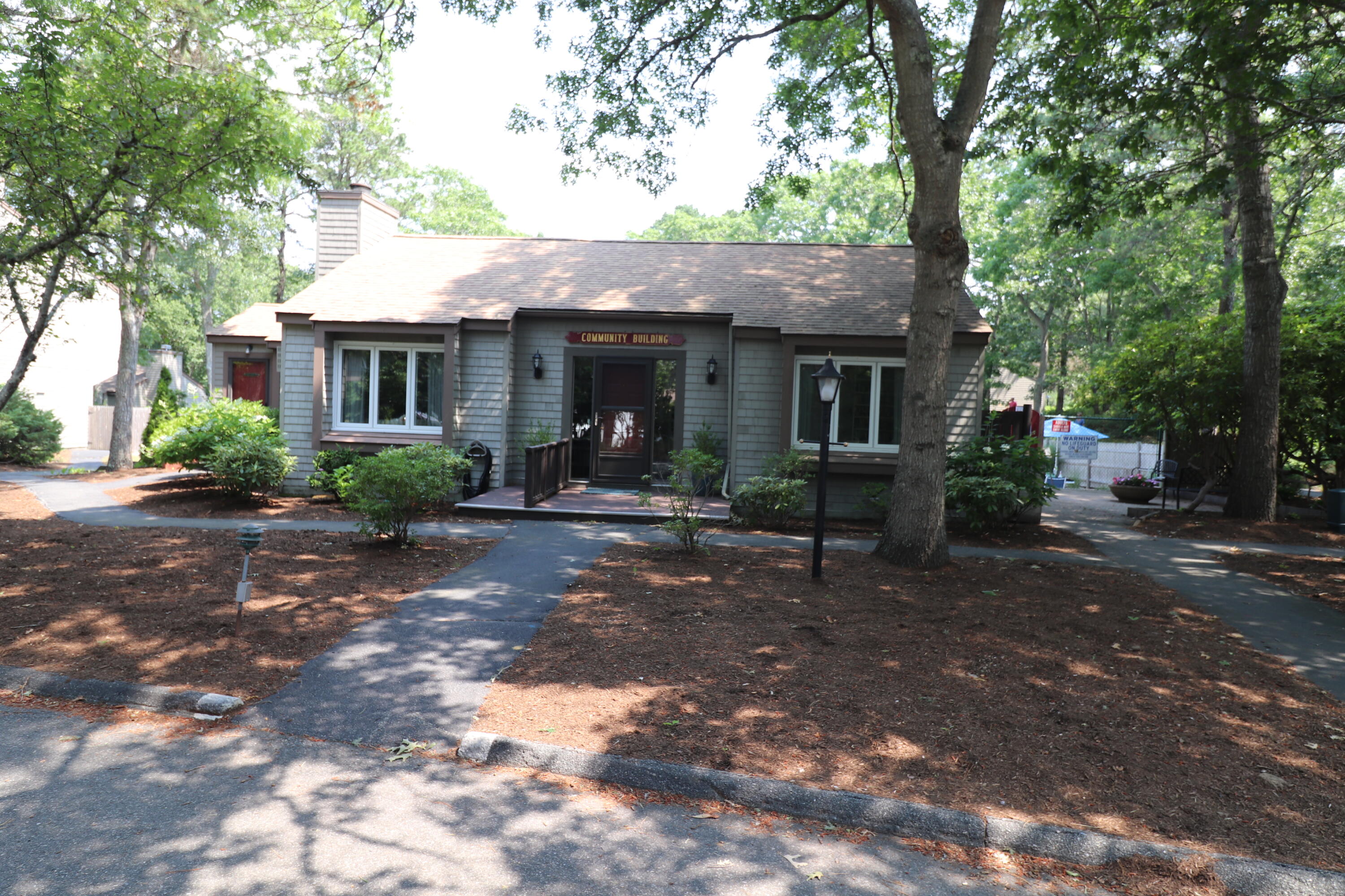 59 Route 6A, Unit 323 Orleans, MA 02653 - Photo 19 of 23 a view of house with a outdoor space