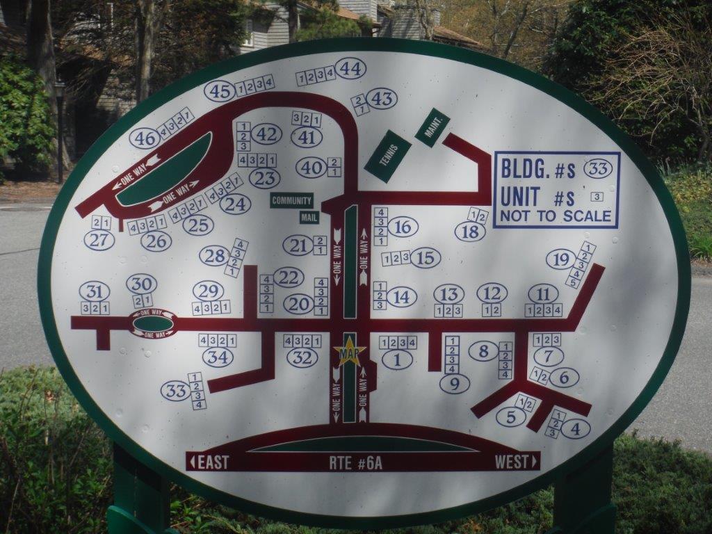 59 Route 6A, Unit 323 Orleans, MA 02653 - Photo 20 of 23 an aerial view of a table and chairs in the outdoor