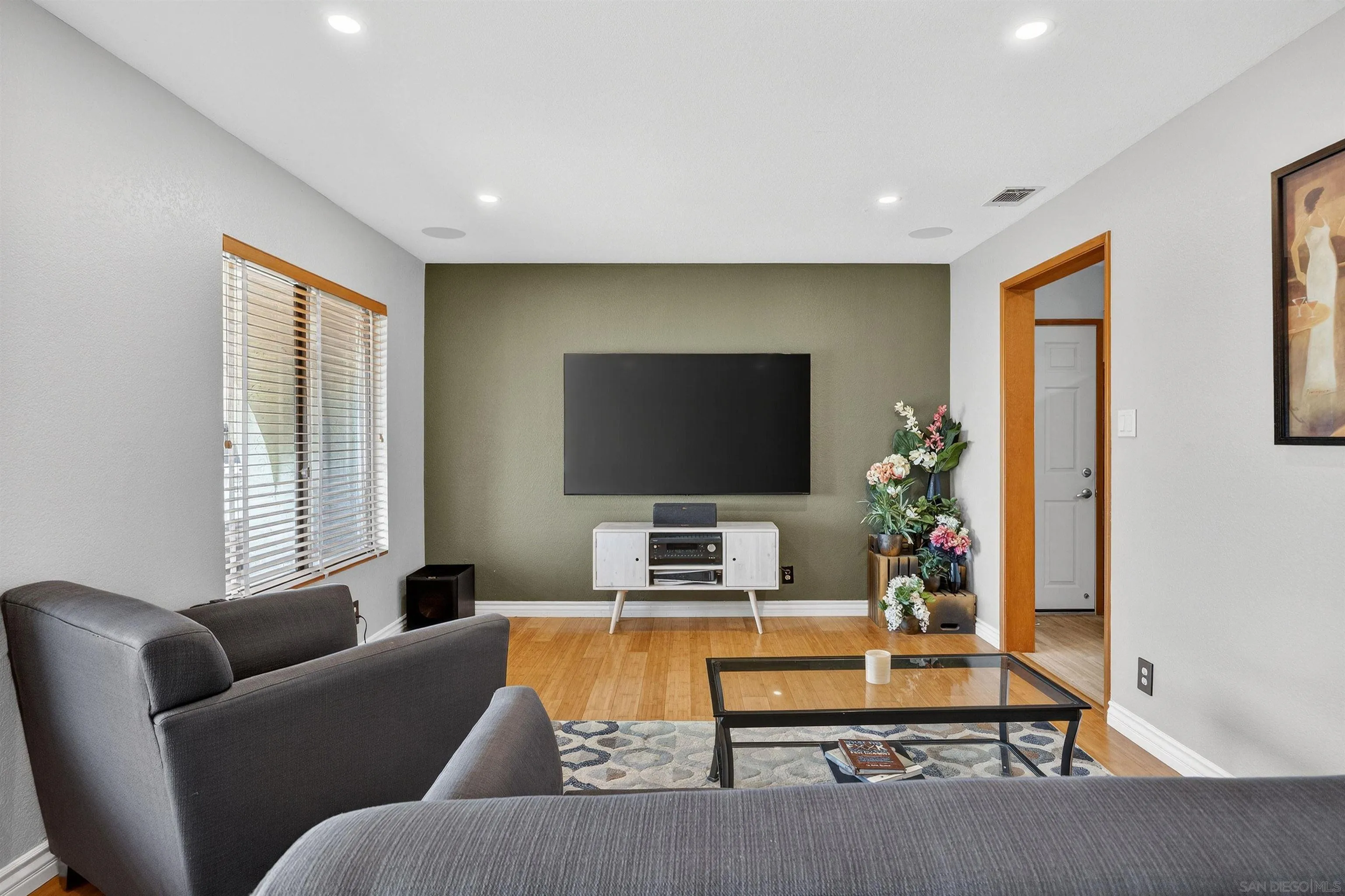 32721 Mountain View Road Bonsall, CA 92003 - Photo 5 of 33 a living room with furniture and a flat screen tv