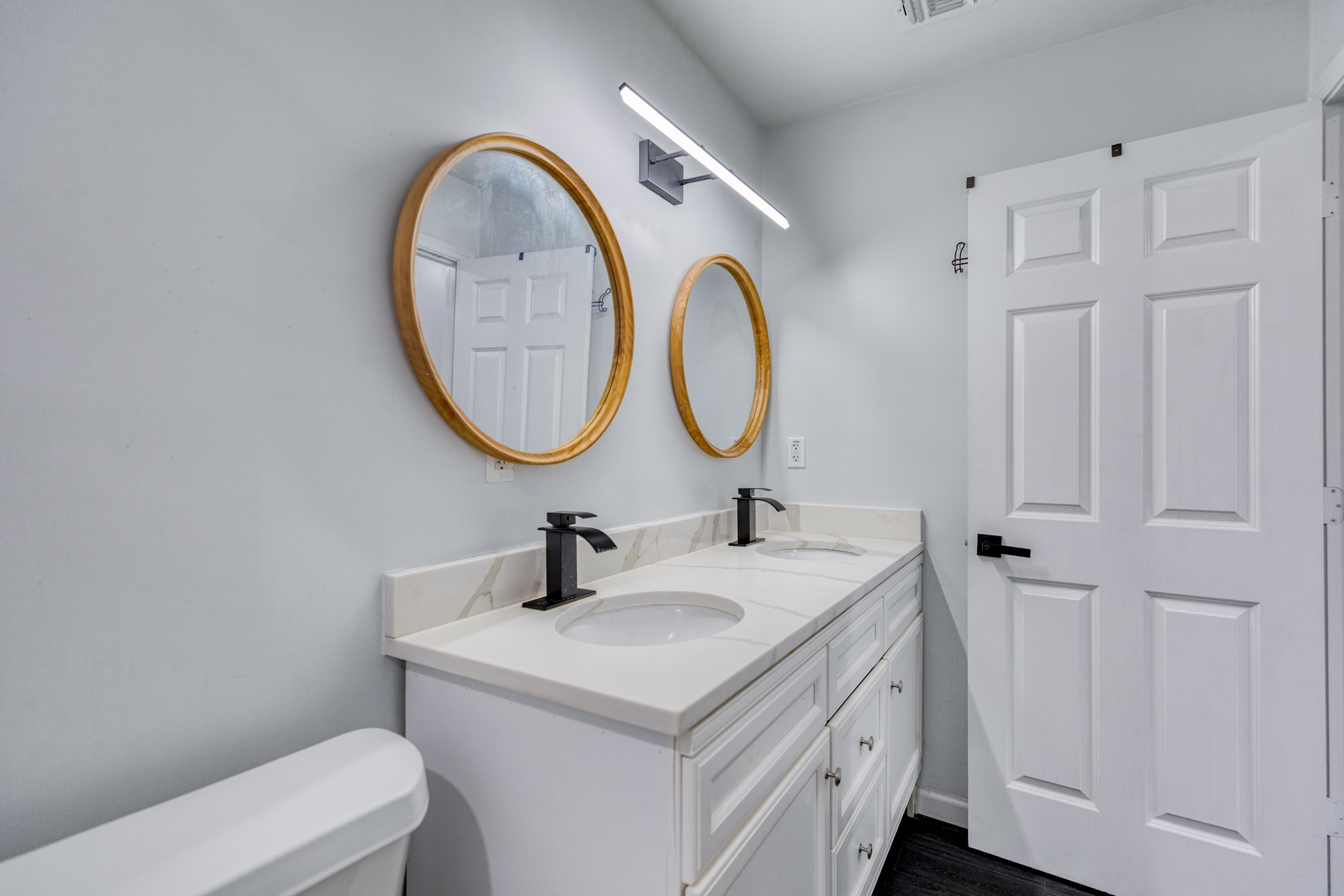6202 Carnation Terrace Austin, TX 78741 - Photo 14 of 17 a bathroom with a sink and a mirror
