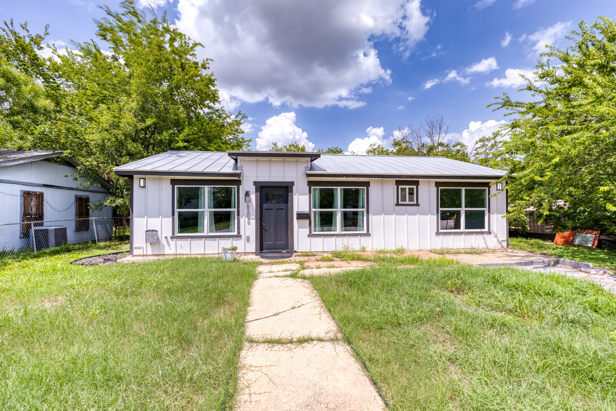 6202 Carnation Terrace Austin, TX 78741 - Photo 17 of 17 a front view of a house with a garden