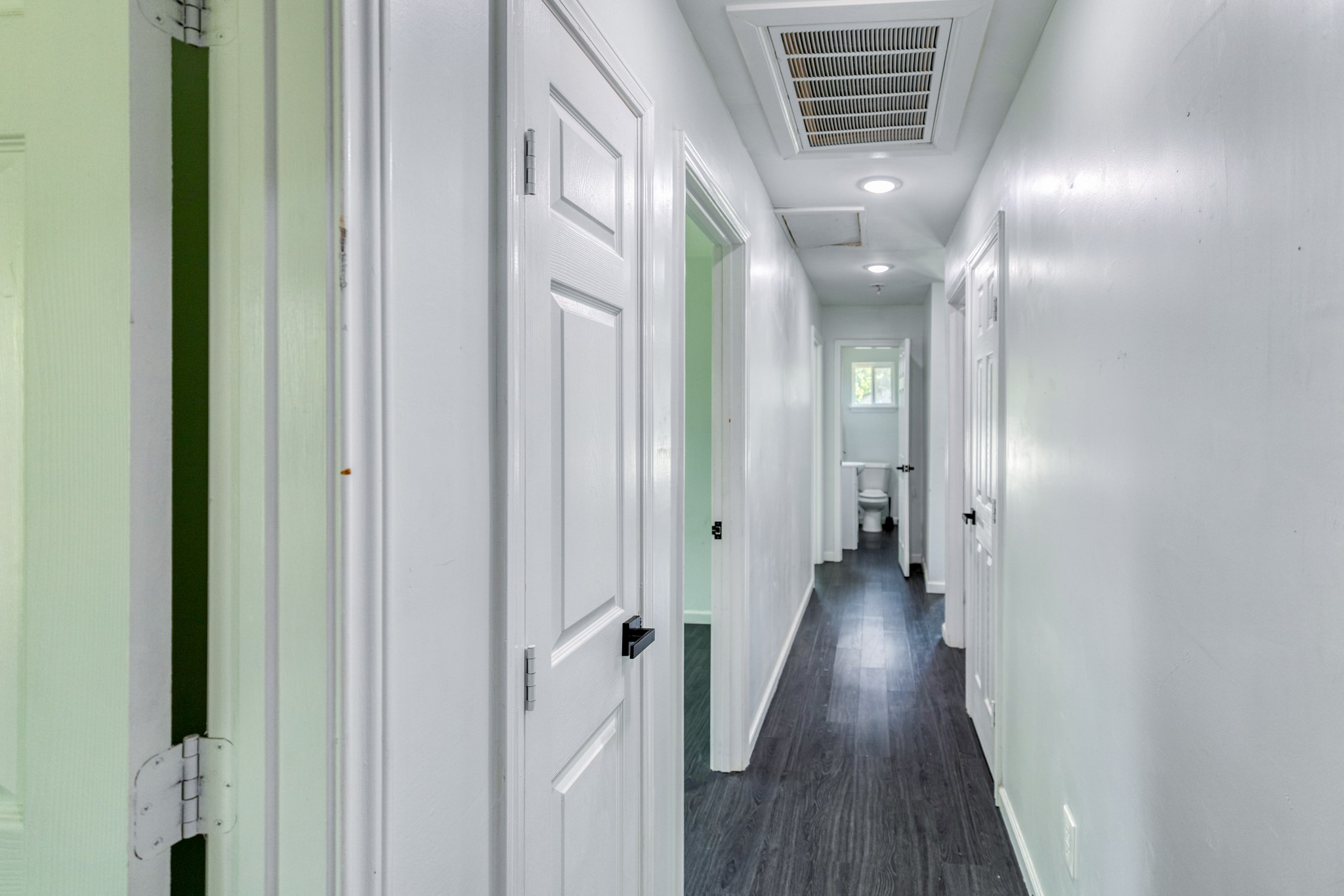 6202 Carnation Terrace Austin, TX 78741 - Photo 8 of 17 a view of a hallway with wooden floor