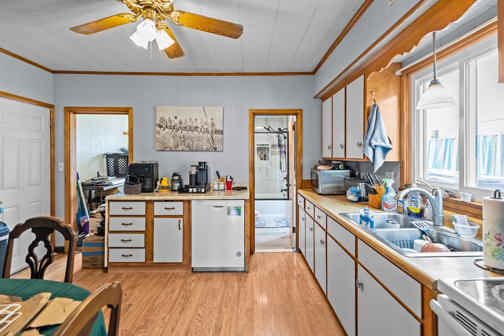 97 Warwick Street Woonsocket, RI 02895 - Photo 13 of 40 a kitchen with a sink appliances cabinets and dining table