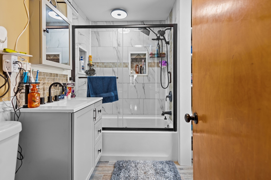 97 Warwick Street Woonsocket, RI 02895 - Photo 16 of 40 a bathroom with a sink toilet and shower