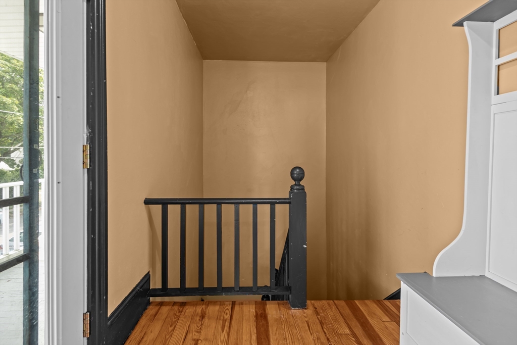 97 Warwick Street Woonsocket, RI 02895 - Photo 19 of 40 a view of walk in closet with wooden floor