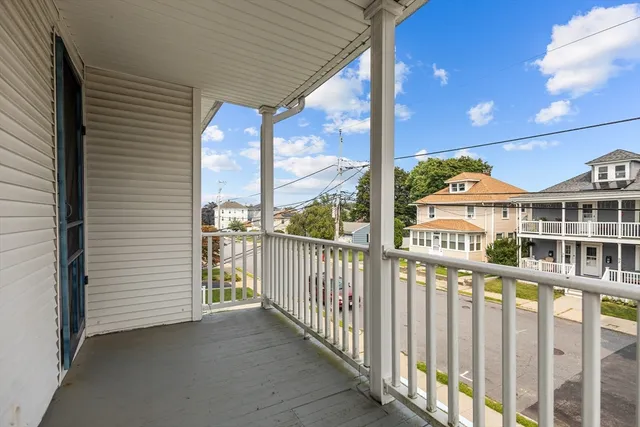 a view of a balcony with city view