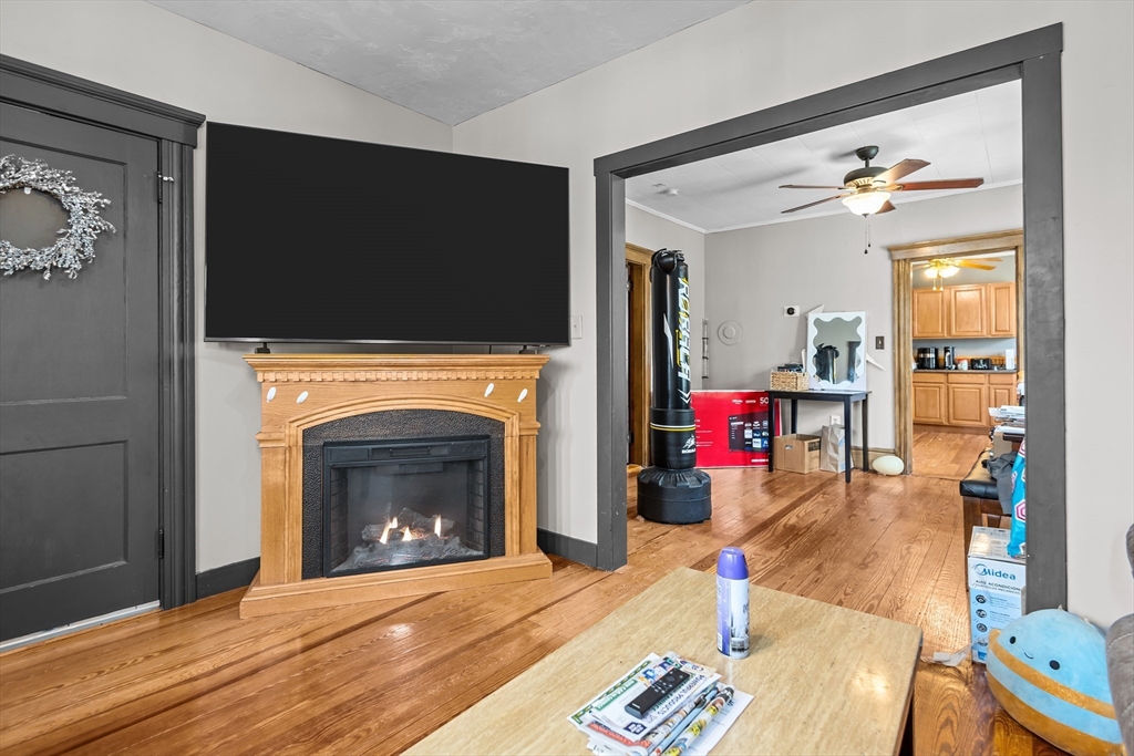 97 Warwick Street Woonsocket, RI 02895 - Photo 23 of 40 a living room with furniture and a fireplace