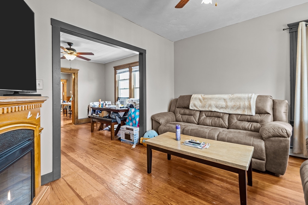 97 Warwick Street Woonsocket, RI 02895 - Photo 25 of 40 a living room with furniture and a fireplace