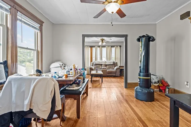 a living room with furniture fireplace and flat screen tv
