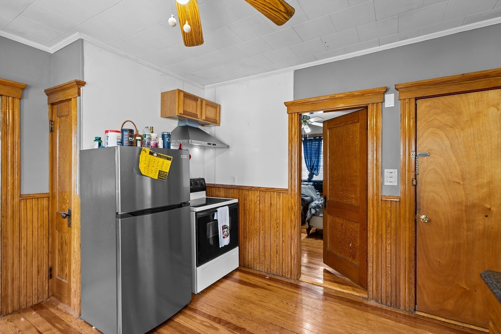 97 Warwick Street Woonsocket, RI 02895 - Photo 27 of 40 a view of a refrigerator in kitchen and a window