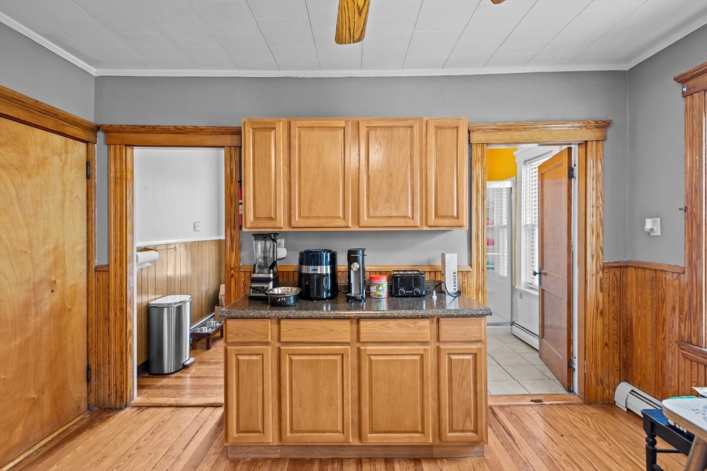 97 Warwick Street Woonsocket, RI 02895 - Photo 29 of 40 a kitchen with stainless steel appliances granite countertop a refrigerator and cabinets