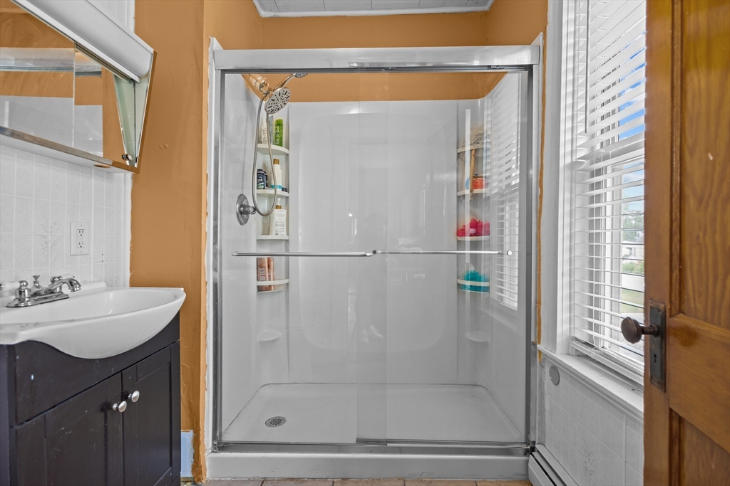 97 Warwick Street Woonsocket, RI 02895 - Photo 33 of 40 a bathroom with a shower and a sink