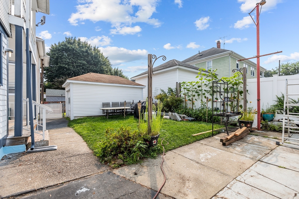 97 Warwick Street Woonsocket, RI 02895 - Photo 4 of 40 a view of a house with backyard and garden