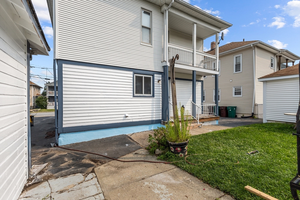 97 Warwick Street Woonsocket, RI 02895 - Photo 6 of 40 a front view of a house with a yard and garage
